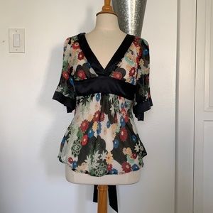 Floral see through faux wrap top with satin trim